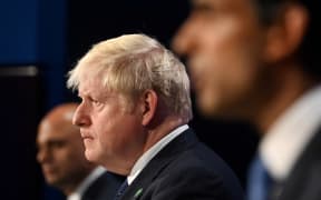 (File photo) Britain's Prime Minister Boris Johnson, centre, Health Secretary Sajid Javid, left, and Chancellor of the Exchequer Rishi Sunak attend a press conference inside the Downing Street Briefing Room on 7 September 2021.