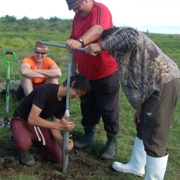 A core sample is taken with a soil auger.