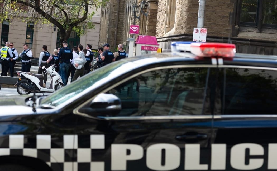 Police officers in undercover uniform are seen during a demonstration organised by a global environmental movement group Extinction Rebellion that started at The State Library, in Melbourne, Australia on Friday, March 26, 2021.