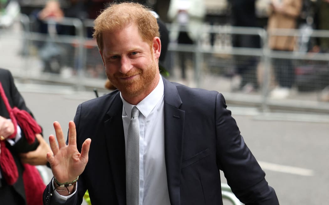 Prince Harry, Duke of Sussex, waves as he arrives to the Royal Courts of Justice, Britain's High Court, in central London on June 7, 2023.