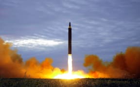 This picture from KCNA - taken on 29 August and released on 30 August - shows North Korea's Hwasong-12 lifting off from an undisclosed location near Pyongyang.