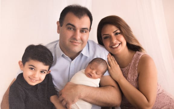 A family picture showing father Siamak, mother Mohadeseh and their son's Arteen (left) and Radeen (center) before the crash last Easter weekend which killed both Arteen and Radeen.