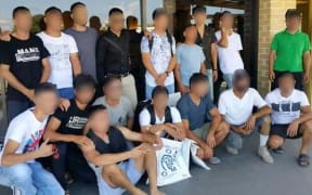 Some of the refugees and their friends at Nauru airport.