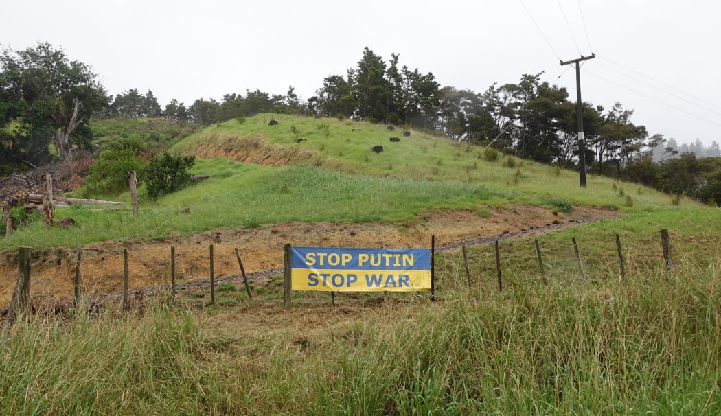 Ukraine flag protest message outside a Helena Bay property.