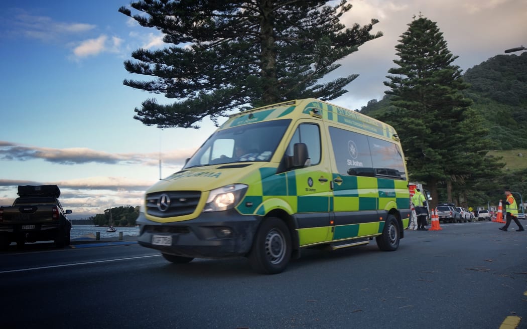 An smbulance is seen leaving the search operation at Mount Maunganui Beachside Holiday Park on Friday morning.