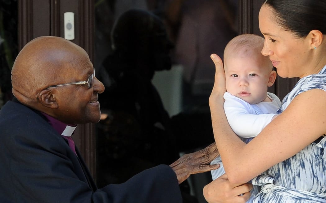 Britain's Duchess of Sussex Meghan hold her baby son Archie as she and the Duke meet with Archbishop Desmond Tutu and his wife at the Tutu Legacy Foundation  in Cape Town on September 25, 2019.