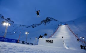 Luca Harrington competing under the lights at the Big Air World Cup finals. Credit Chad Buchholz / FIS Freestyle