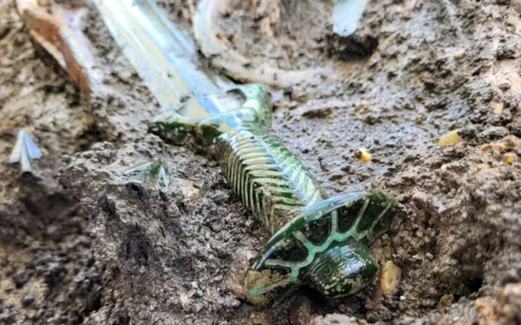 The bronze sword had an octagonal hilt, and while archaeologists did not find evidence the blade had been used 'in anger', it appears to have been designed as a functional sword.