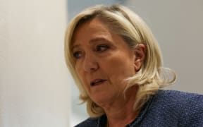 President of the parliamentary group of the French far-right Rassemblement National (RN) party, Marine Le Pen arrives at the Paris courthouse for her trial verdict on suspicion of embezzlement of European public funds, in Paris, on March 31, 2025. A French court on March 31 will rule in the trial of far-right leader Marine Le Pen over an alleged fake jobs scam at the EU parliament, a verdict which could ruin her chances of standing in the next presidential elections in two years. (Photo by Alain JOCARD / AFP)