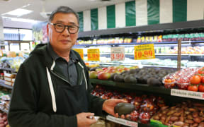 Avocados for sale at $10.99 each in Jack Lum's Auckland greengrocery.