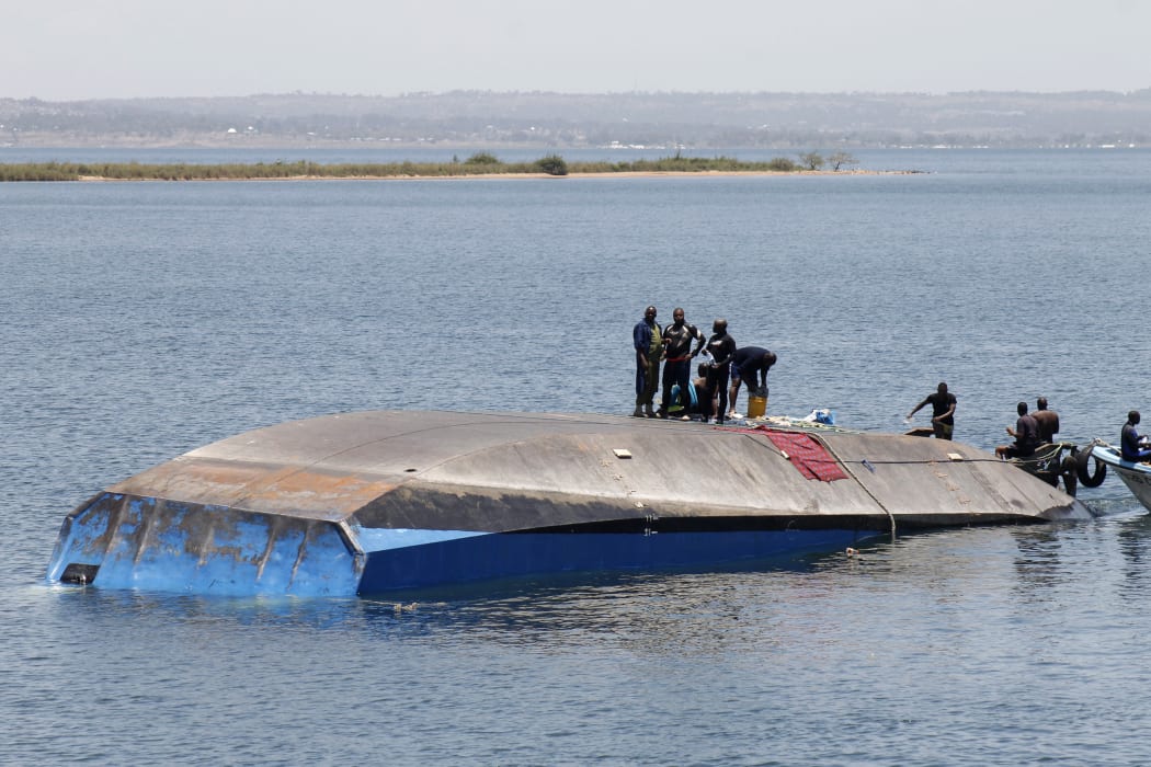 Tanzanian rescue workers search for victims, a day after the ferry MV Nyerere capsized in Lake Victoria.