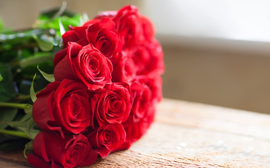 Red roses bouquet. Flowers. Romantic background