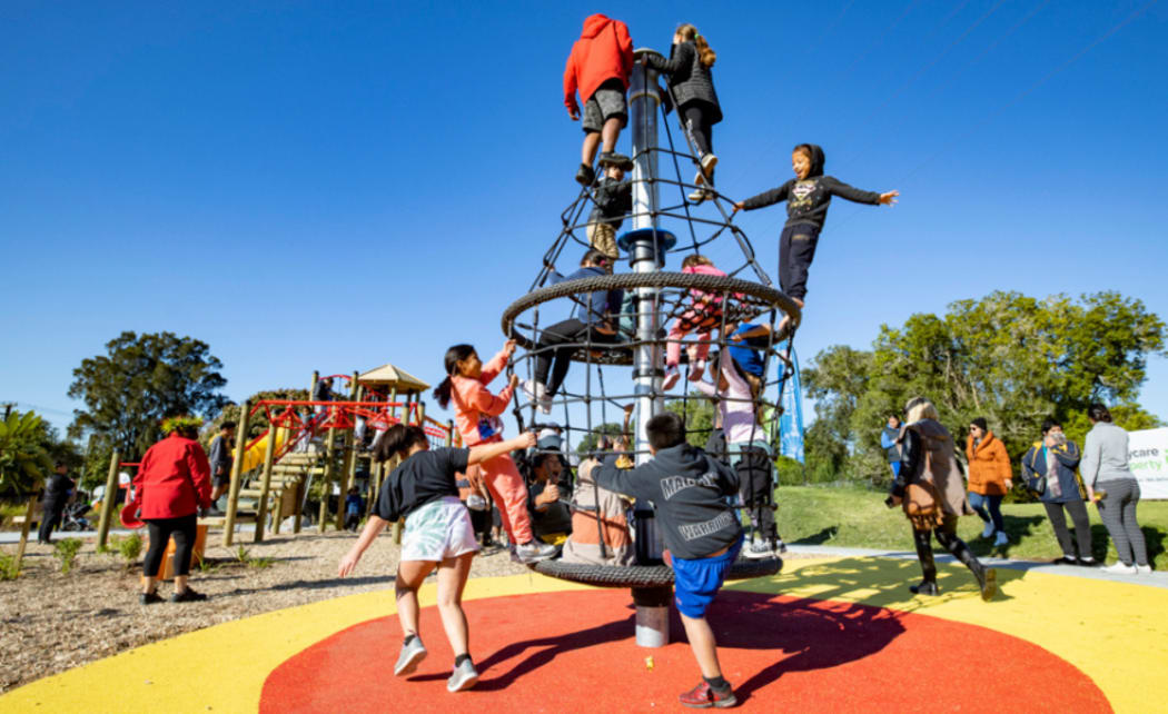 Children playing at Toetoe-roa/Cooper Park after its opening on 3 July.