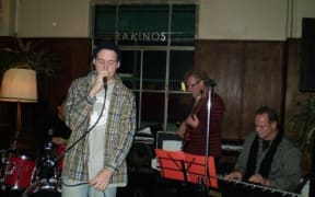 Tom Scott on the left, and Peter Scott, centre, on bass.