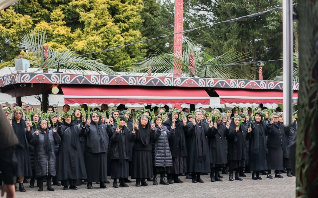 Tangata whenua welcoming visitors onto Tuurangawaewae Marae.