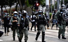 Police officers control the demonstration in Hong Kong Island on July 1, 2020, on the 23rd anniversary of the former British colony's handover to China.