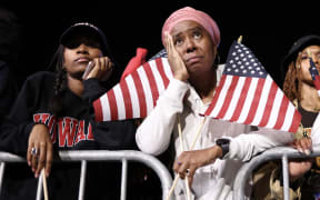 Supporters of US Vice President and Democratic presidential candidate Kamala Harris react during an election night event at Howard University in Washington, DC, on November 5, 2024. (Photo by CHARLY TRIBALLEAU / AFP)