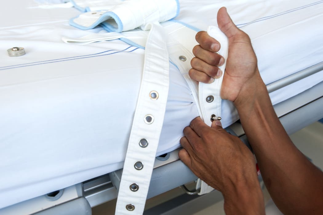 Bed with restraints