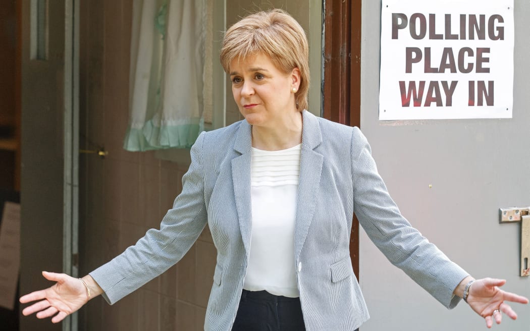 Scotland's First Minister and Leader of the Scottish National Party (SNP), Nicola Sturgeon, reacts as leaves after voting at a polling station at Broomhouse Community Hall in east Glasgow, on June 23, 2016,