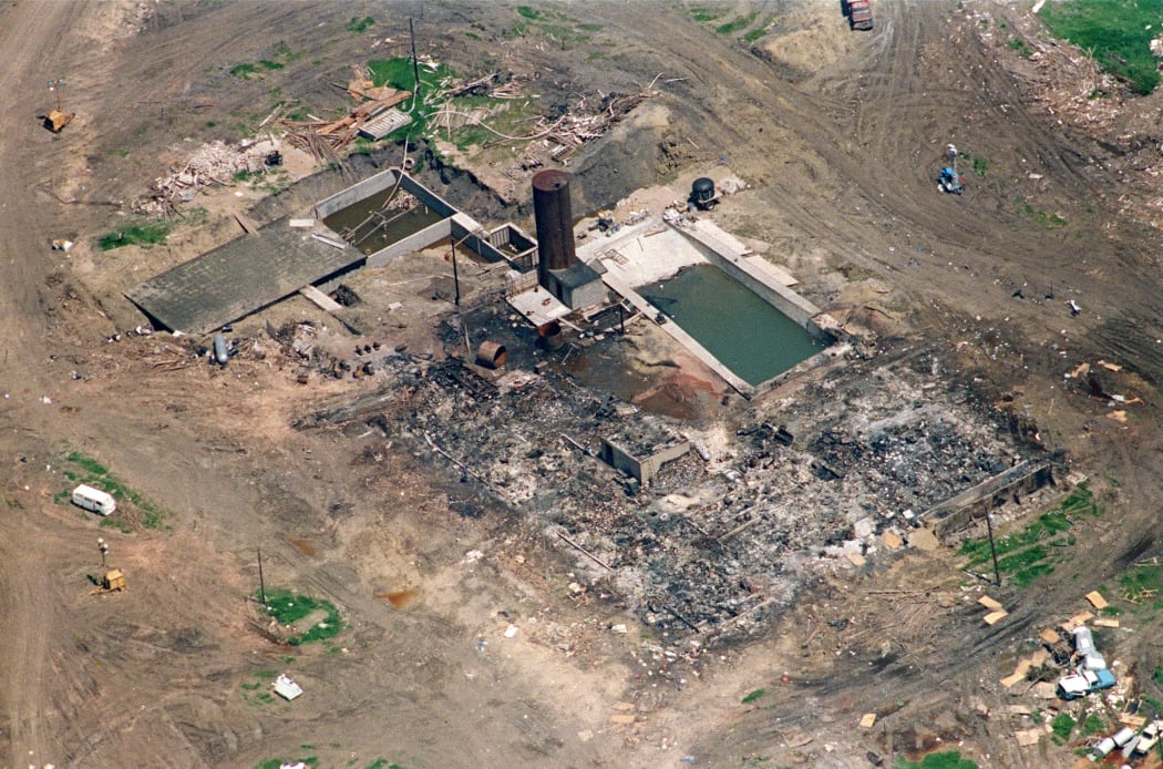 21 April 1993 in Waco, the only structure left standing after a fire destroyed The Branch Davidian cult compound 19 April. FBI and Texas Rangers check the area for victims of the blaze which ended a 51 day standoff between federal agents and the cult led by David Koresh.