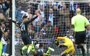 Gabriel Jesus of Manchester City scores from a diving header