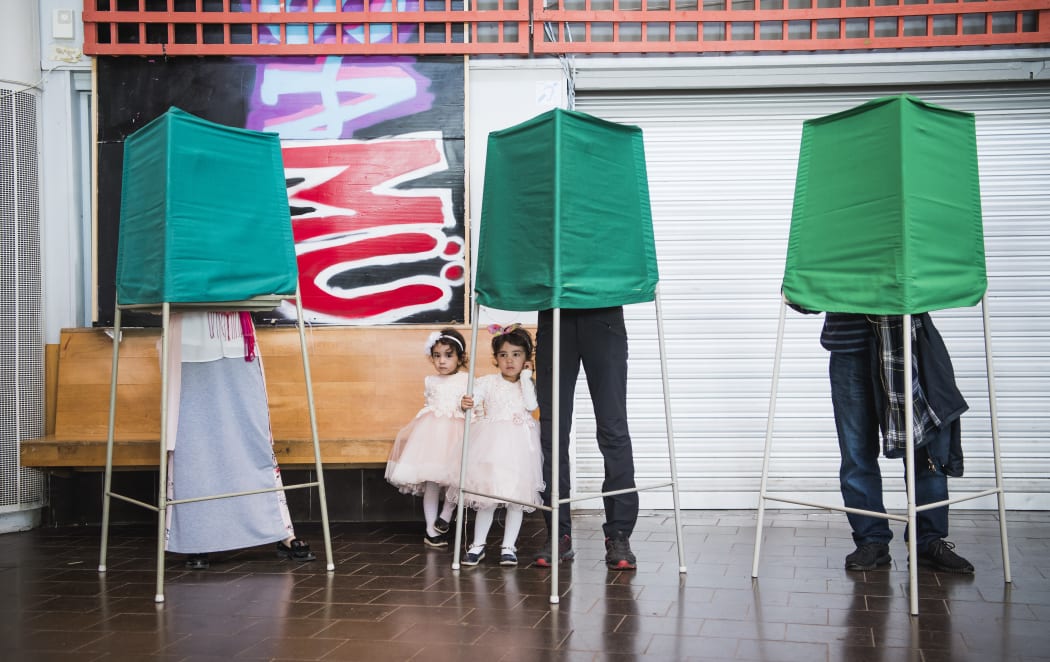 People vote in the Swedish general elections at a polling station in the suburb of Rinkeby, north of Stockholm.