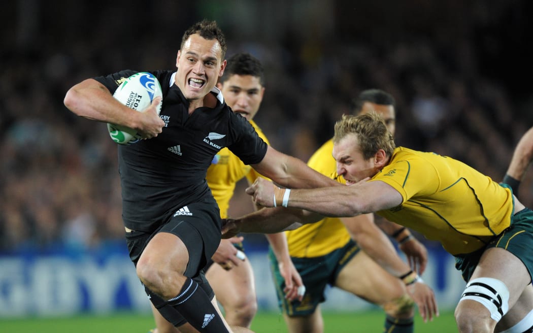 All Blacks fullback Israel Dagg fends off Rocky Elsom during the All Blacks v Australia semifinal match of the 2011 IRB Rugby World Cup at Eden Park, Auckland, New Zealand on Saturday, 16 October 2011. Photo: Dave Lintott / photosport.co.nz
