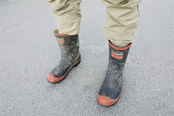 Alex is wearing Red Band gumboots, RM Williams belt, Stoney Creek shirt, and Hunters Element pants at Fieldays on 11 June, 2025.