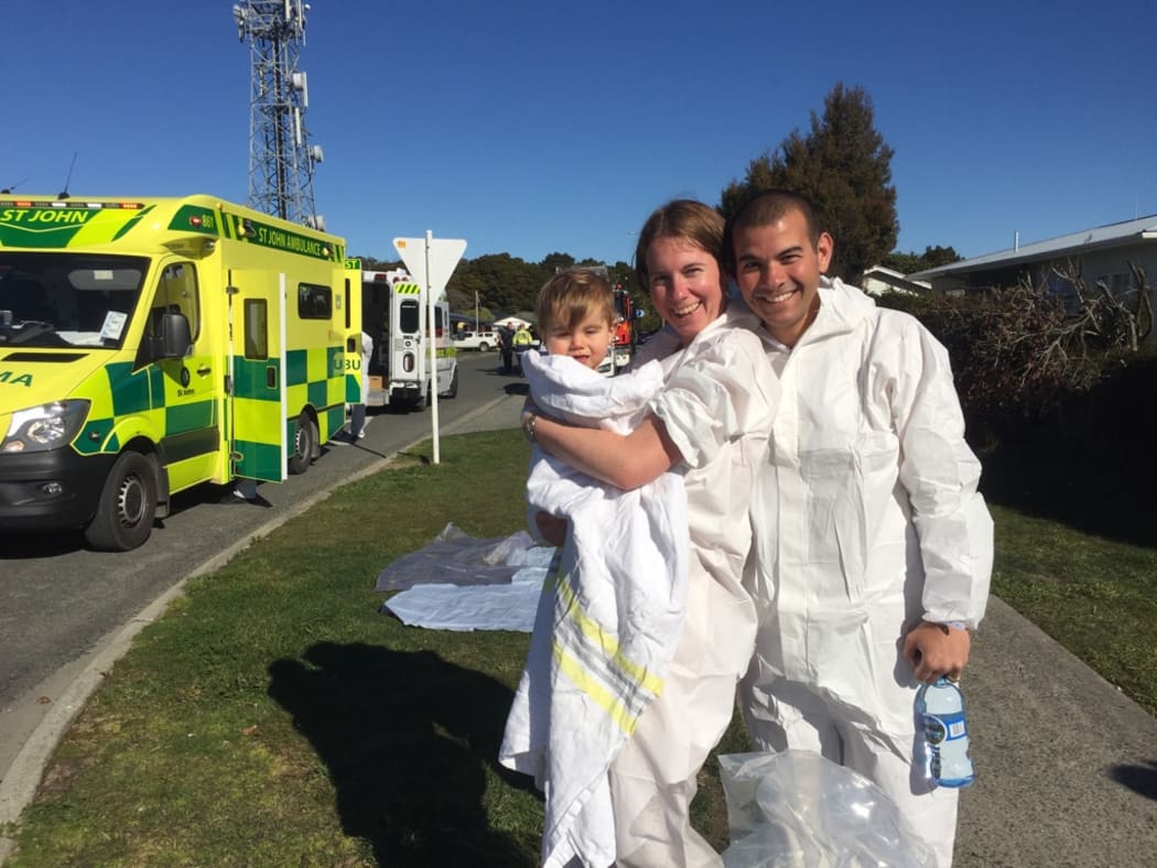 Alison, Mark and Barney Hossain after the decontamination shower.
