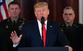 US President Donald Trump speaks about the situation with Iran in the Grand Foyer of the White House.
