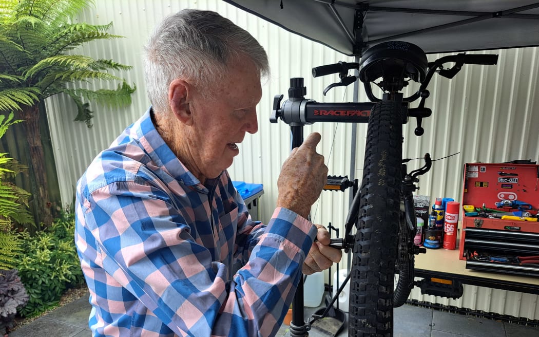 Chris Carrothers fixing a bike.