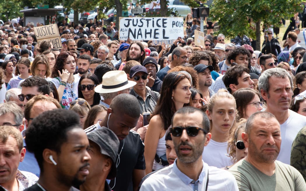 France, Nanterre, June 29, 2023. White march in honor of the mother of Nahel, a 17-year-old boy shot dead by a police officer after refusing to obey a traffic stop in Nanterre. Participants and family demand justice for Nahel . Valerie Dubois / Hans Lucas.
France, Nanterre, le 29 juin 2023. Marche blanche a l’appel de la mere de Nahel, jeune garcon de 17 ans abattu par un policier apres un refus d obtemperer lors d un controle routier a Nanterre. Les participants et la famille demandent justice pour Nahel. . Valerie Dubois / Hans Lucas (Photo by Valerie Dubois / Hans Lucas / Hans Lucas via AFP)