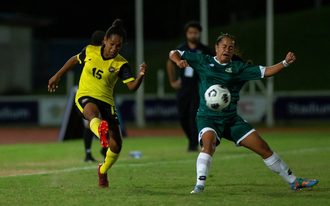 Action from the Cook Islands (in green) quarter-final match against Vanuatu.