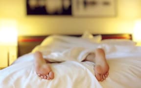 women's feet in bed