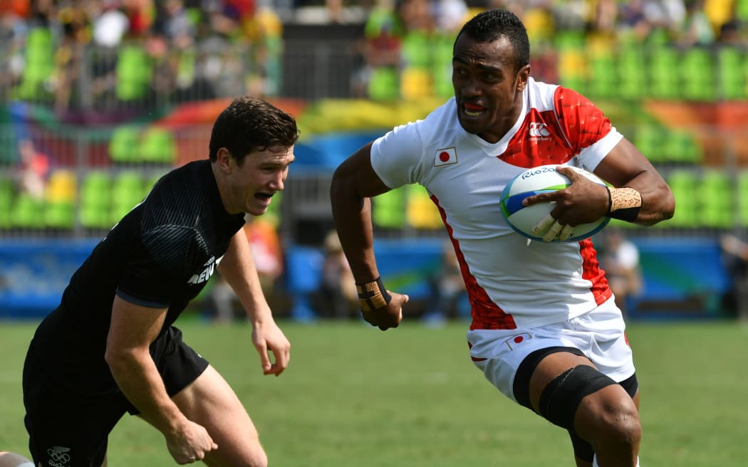 Japan's Kameli Soejima scores a try in the men’s rugby sevens match against New Zealand.