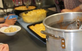 A photo of the pots of food on offer at the school hall. The "refugees" could pay a donation for a hot meal prepared by volunteers.