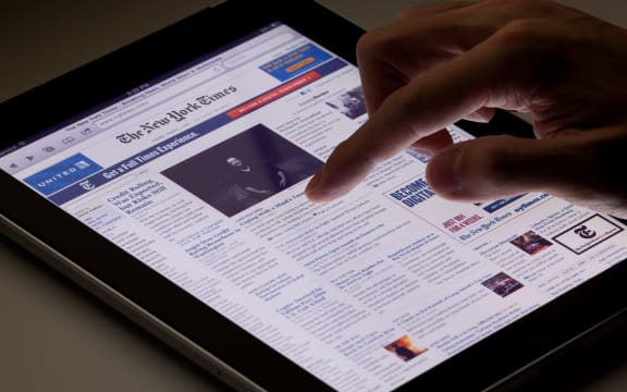 Hong Kong, China - August 7, 2011: Image of browsing the New York Times website using an ipad. The New York Times is a popular American daily newspaper and its website is the most popular American online newspaper website.