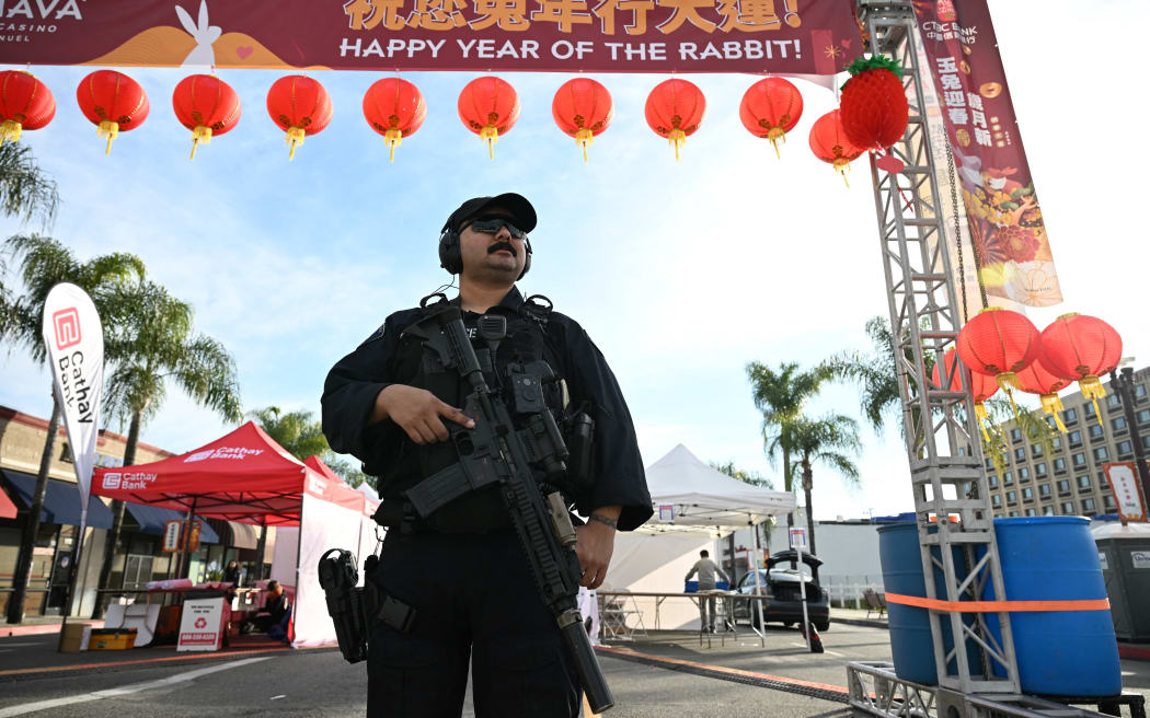 A police officer stands at the scene of a mass shooting in Monterey Park, California, on January 22, 2023.