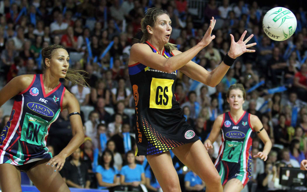 Magic ahooter Irene Van Dyk secures the ball under pressure from Vixens' Geva Mentor. Waikato/BOP Magic v Melbourne Vixens. ANZ Netball Championship. Mystery Creek Events Centre, Hamilton, New Zealand. Monday 21st March 2011. Photo: Anthony Au-Yeung / photosport.co.nz