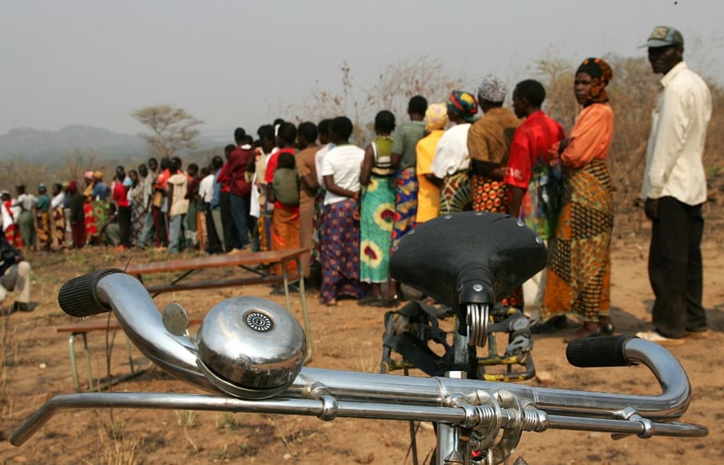 Zambians stand in line to vote 28 September 2006 at a polling station in the small village of Palabana.