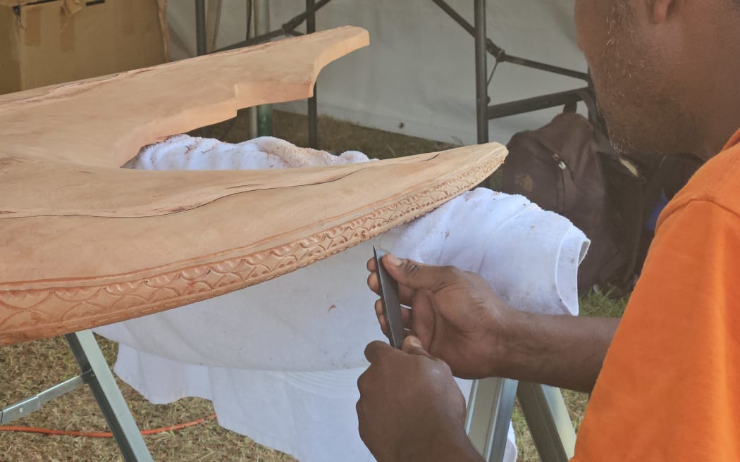 Master carver from Palau at work.
