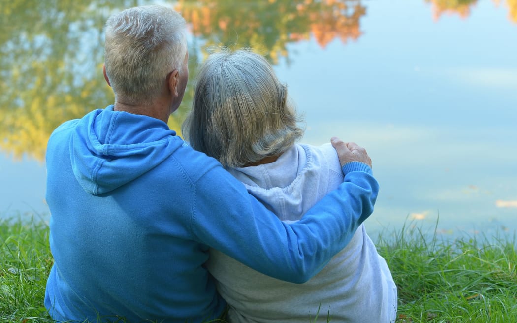 Mature couple walking in the park in the afternoon
