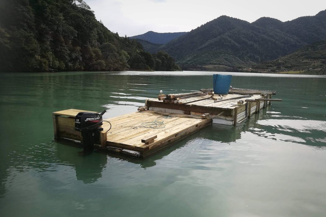 "Homemade" raft or barge in Kaiuma Bay (near Havelock) In the Marlborough Sounds.