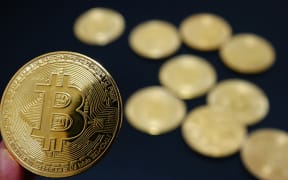 Commemorative bitcoin coins are in Yichang, Hubei province, China, on December 5, 2024. (Photo by Costfoto/NurPhoto) (Photo by CFOTO / NurPhoto / NurPhoto via AFP)