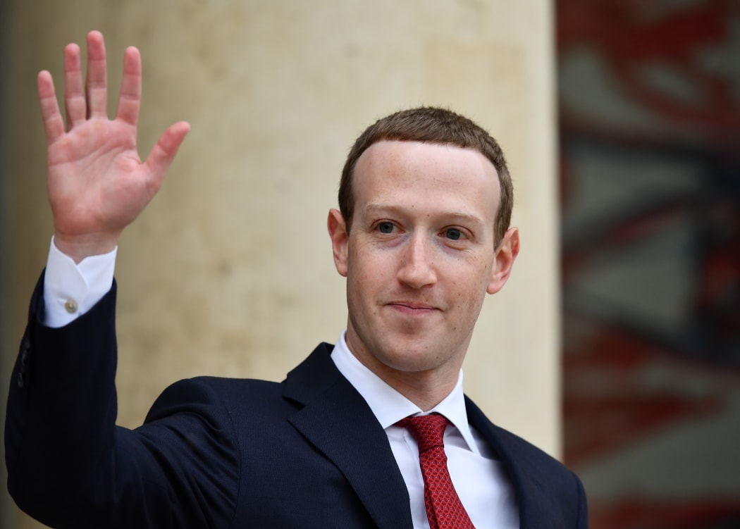 Founder and CEO of Facebook Mark Zuckerberg leaves after a meeting with French President Emmanuel Macron.