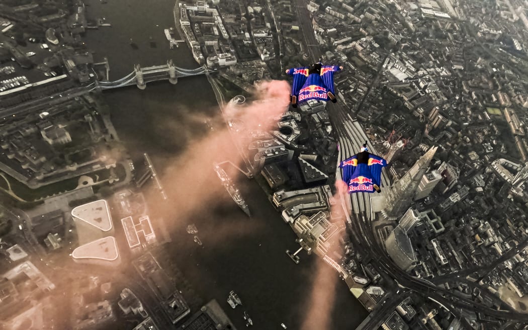 Two Austrian skydivers, Marco Fürst and Marco Waltenspiel, accomplished a remarkable feat by becoming the first individuals to successfully navigate a wingsuit flight through London's iconic landmark, Tower Bridge on May 12, 2024. // Marco Fuerst and Marco Waltenspiel of Austria fly through Tower Bridge in London, Great Britain on May, 12, 2024 // Peter Salzmann / Red Bull Content Pool (Photo by Peter Salzmann / Red Bull Content Pool / Red Bull Content Pool via AFP)