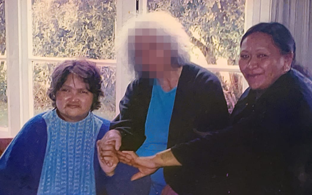 Joyce Harris (right) pictured with her twin sister Toni (left) and their foster mother (center).