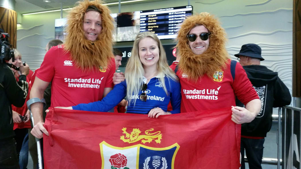 British and Irish Lions' fans await their arrival at Auckland airport.