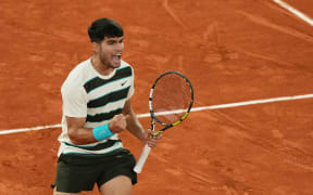 Spain's Carlos Alcaraz reacts to a point against as he plays against Italy's Lorenzo Musetti during their men's singles semi-final match on day 13 of the French Open tennis tournament on Court Philippe-Chatrier at the Roland-Garros Complex in Paris on June 6, 2025. (Photo by Dimitar DILKOFF / AFP)