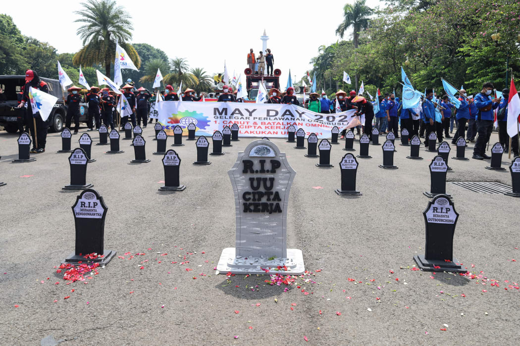 Job creation bill gravestones were erected in the street in Jakarta, for International Workers' Day.